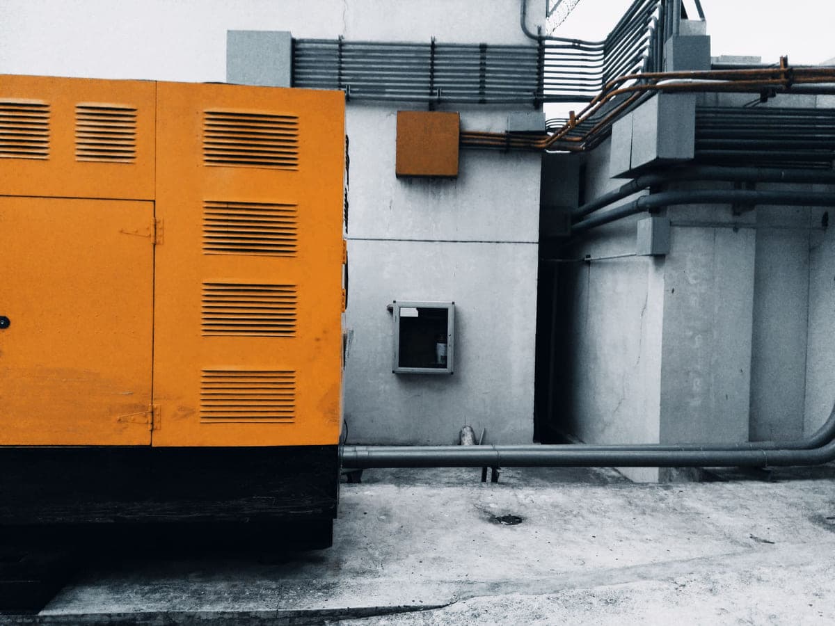 Enclosed standby diesel generator installed outside a building